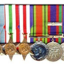 Mounted with .001-.005. Defence Medal is a reproduction.